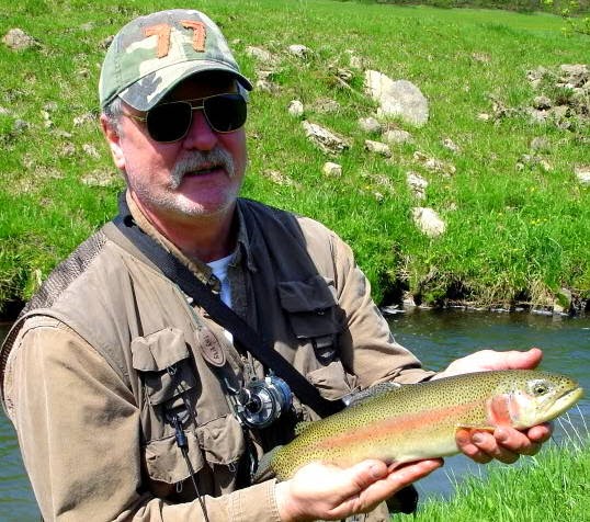 fisherman with rainbow trout